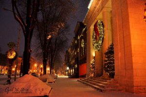 The Adirondack Trust Company on Broadway with a festive view of Broadway.