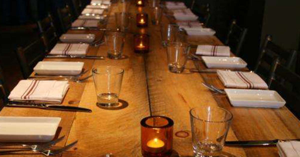 a restaurant table set up for people