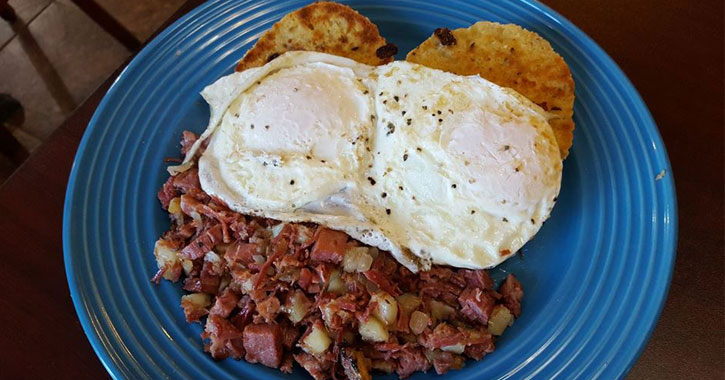 eggs over hash browns on a plate