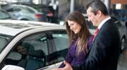 Car Dealer Helping Woman