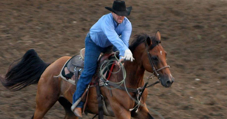 a man on a horse during a rodeo