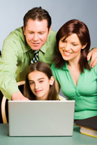 family at laptop computer