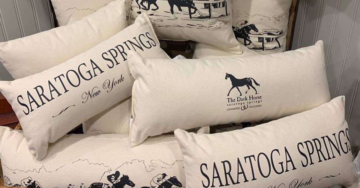 group of saratoga and horse pillows