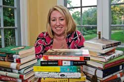 woman surrounded by piles of books