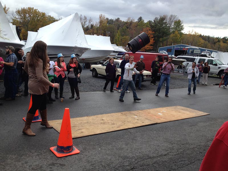 Woman throwing a keg during competition at Adirondack Pub & Brewery's Oktoberfest