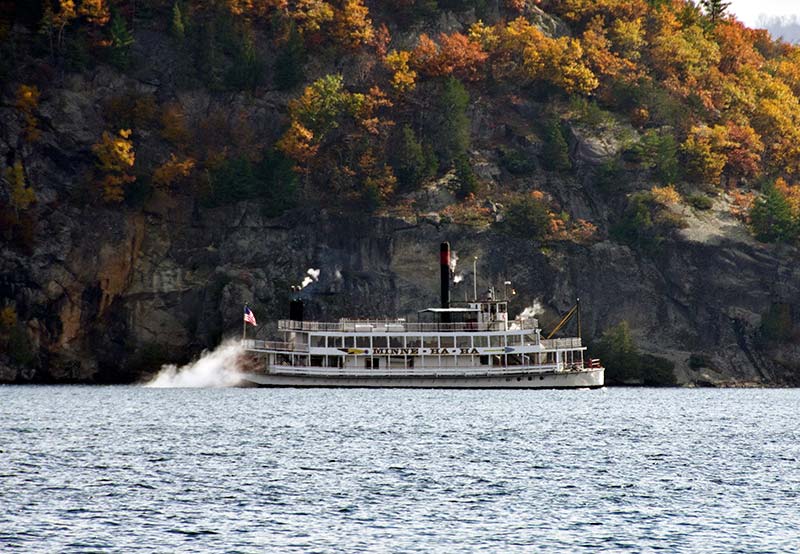 The Minnie Ha Ha steamboat crusing on Lake George during the fall
